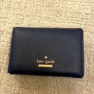 Navy blue Kate Spade medium compact bifold wallet. Great condition.